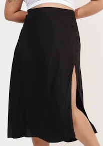 Por que a saia midi é considerada a peça mais elegante e democrática do guarda-roupa?